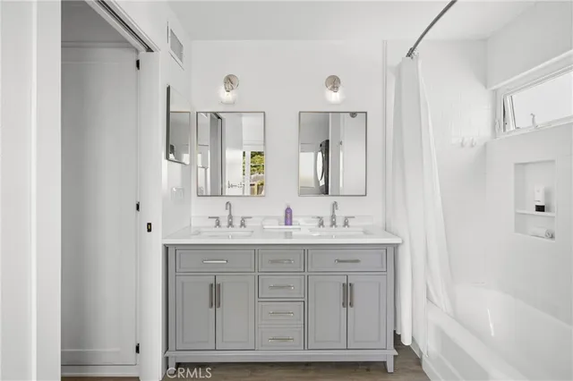 a bathroom with a bathtub and shower