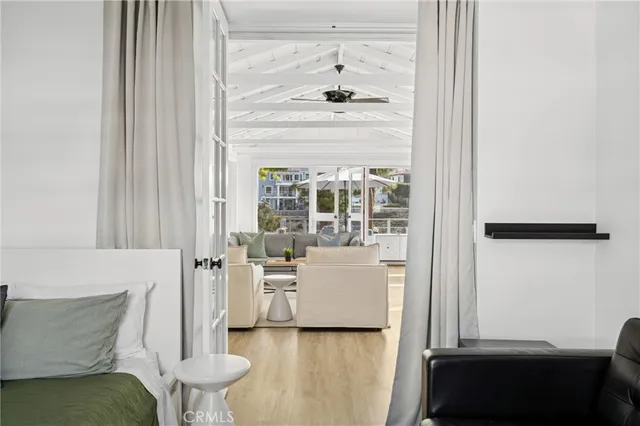 a bathroom with a toilet sink vanity and mirror