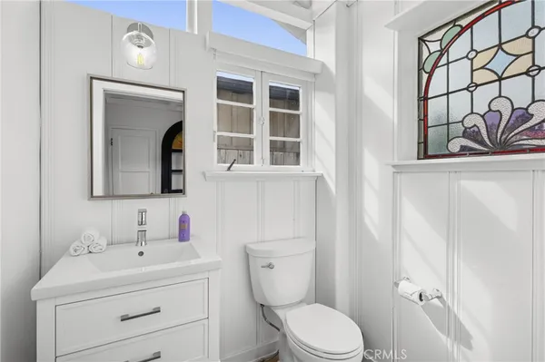 a view of a storage and utility room with washer and dryer