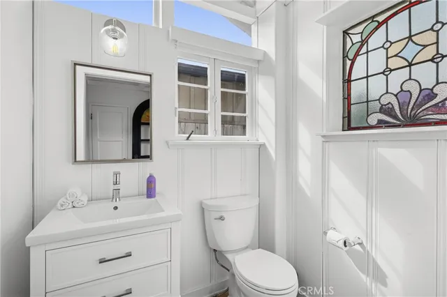 a view of a storage and utility room with washer and dryer