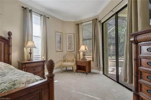 a bedroom with furniture and a window