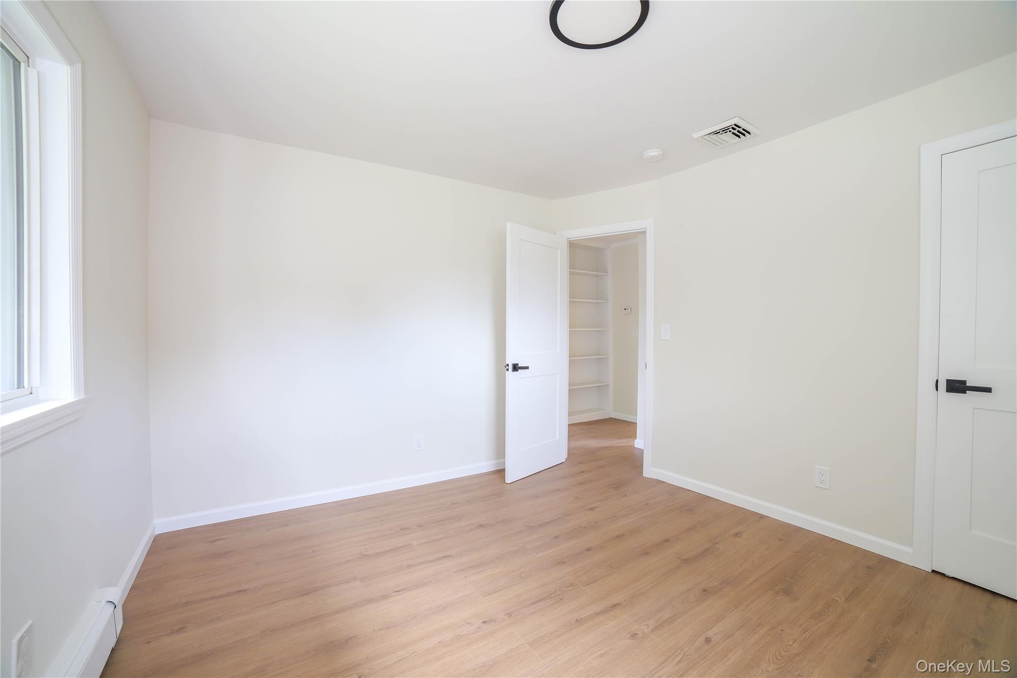 66 Putnam Road Cortlandt Manor, NY 10567 - Photo 14 of 37 a view of a room with wooden floor and window