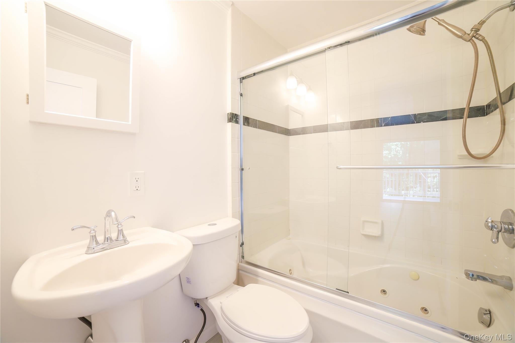 66 Putnam Road Cortlandt Manor, NY 10567 - Photo 18 of 37 a bathroom with a sink toilet and shower