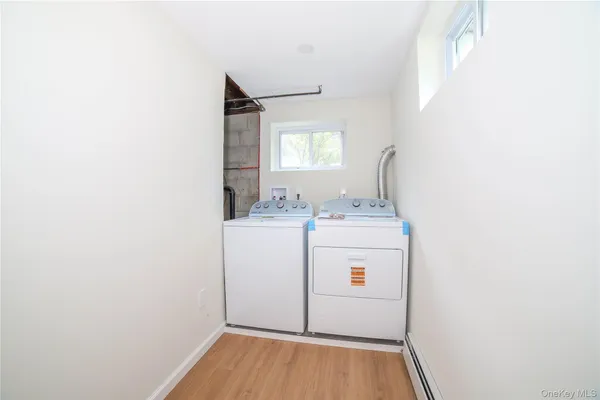 a utility room with dryer and washer