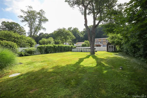 a view of a swimming pool and a yard