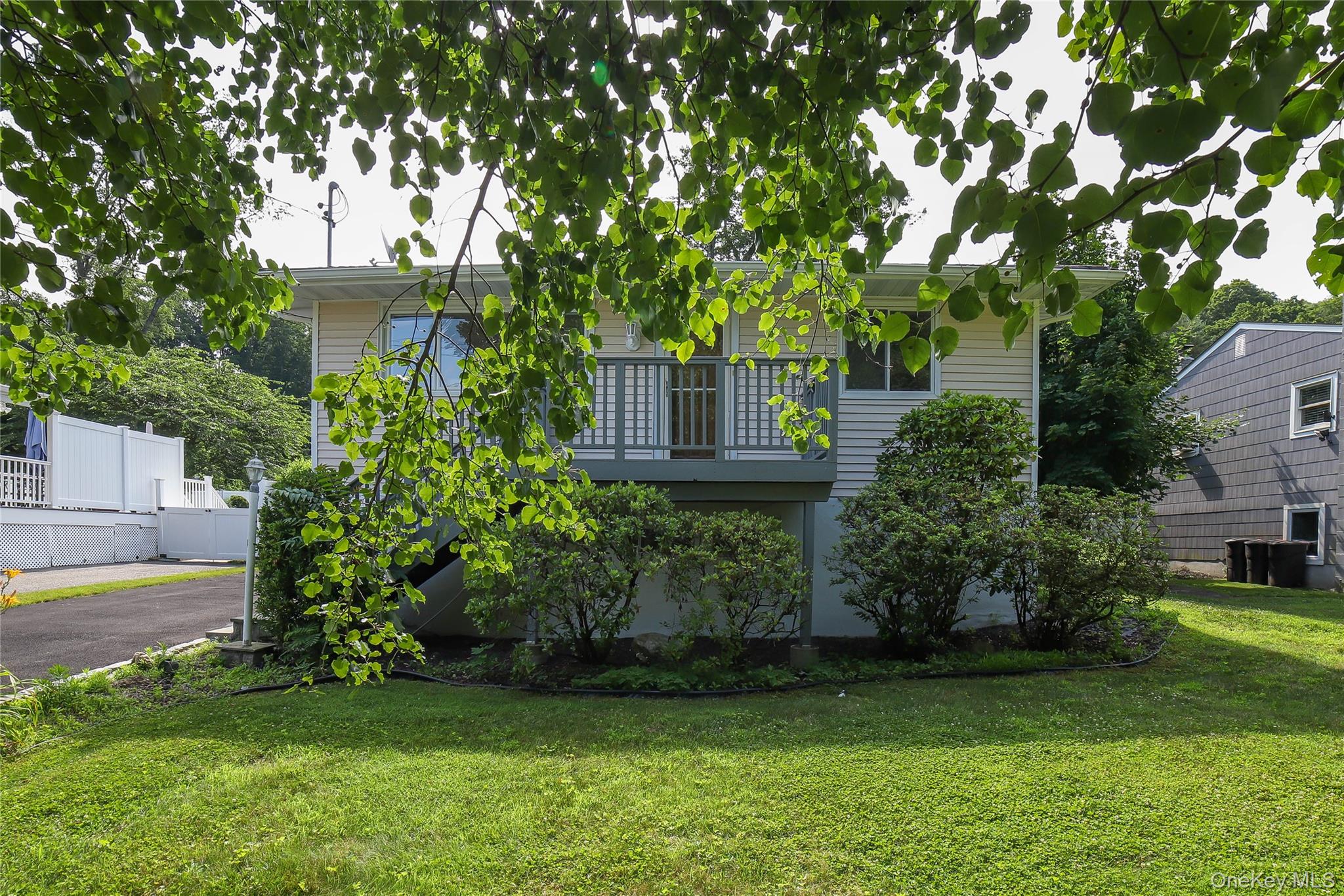 66 Putnam Road Cortlandt Manor, NY 10567 - Photo 3 of 37 a view of a house with a garden