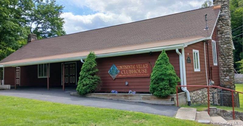 66 Putnam Road Cortlandt Manor, NY 10567 - Photo 34 of 37 a front view of a house with garden
