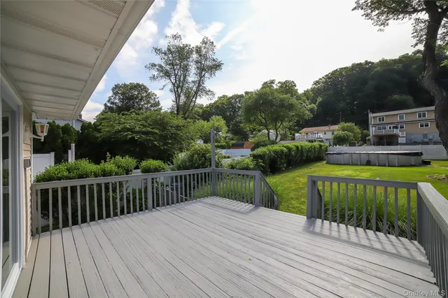 a view of a deck with a backyard