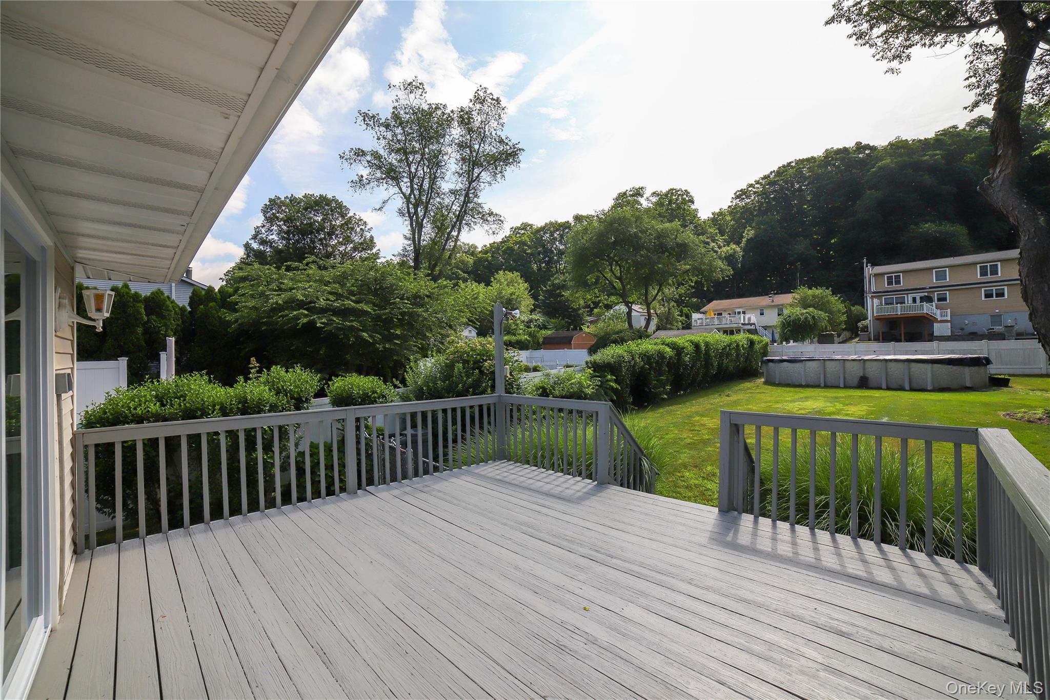 66 Putnam Road Cortlandt Manor, NY 10567 - Photo 4 of 37 a view of a deck with a backyard