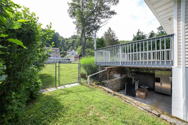 a view of a backyard with sitting area and furniture