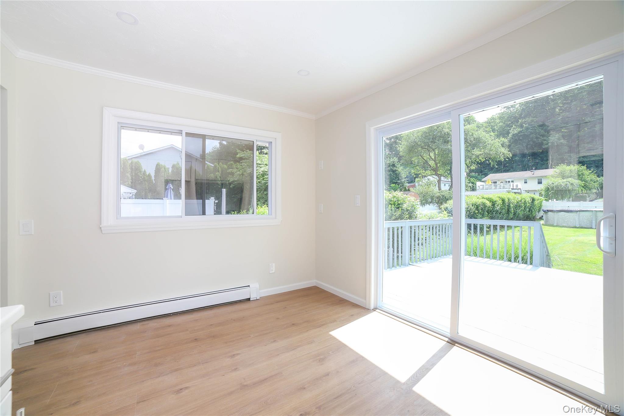 66 Putnam Road Cortlandt Manor, NY 10567 - Photo 10 of 37 a view of an empty room with wooden floor and a window
