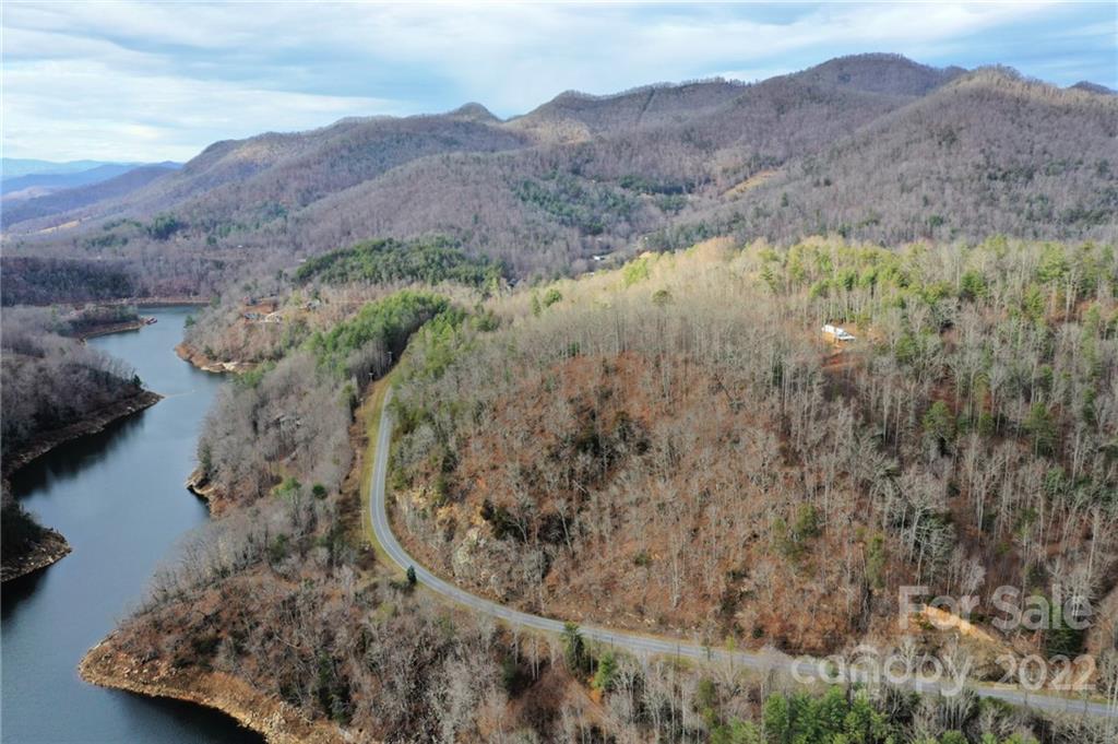 Lot 10 Cedar Cliff Road Tuckasegee, NC 28783 - Photo 13 of 14 a view of a lake in middle of the forest