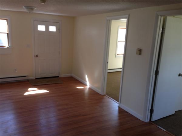 152 Telegraph Road Dennis, MA 02639 - Photo 11 of 11 an empty room with wooden floor and windows