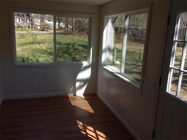 152 Telegraph Road Dennis, MA 02639 - Photo 8 of 11 a view of a porch with wooden floor and furniture