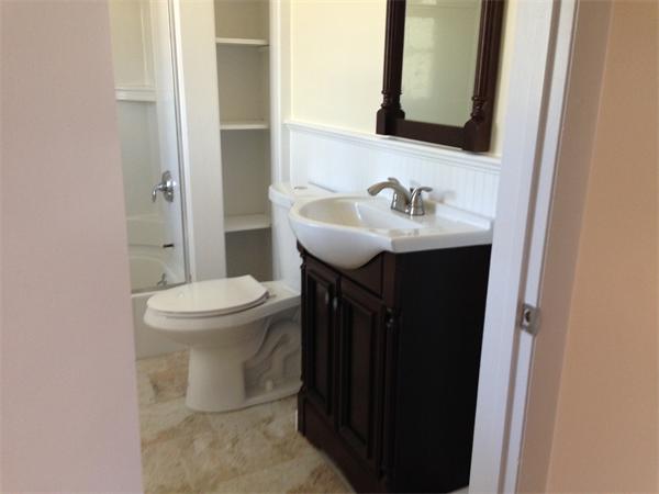 152 Telegraph Road Dennis, MA 02639 - Photo 10 of 11 a bathroom with a sink toilet and mirror