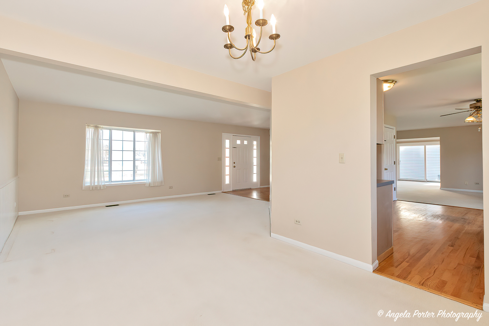 1305 Westport Ridge Crystal Lake, IL 60014 - Photo 6 of 31 wooden floor in an empty room with a window