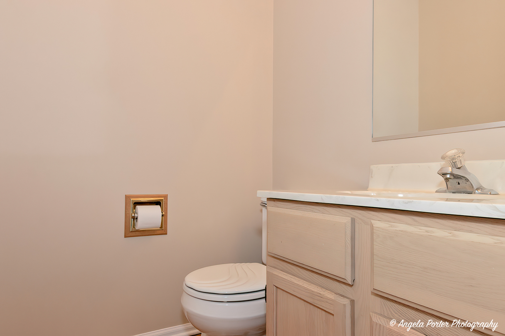 1305 Westport Ridge Crystal Lake, IL 60014 - Photo 7 of 31 a bathroom with a toilet a sink and mirror