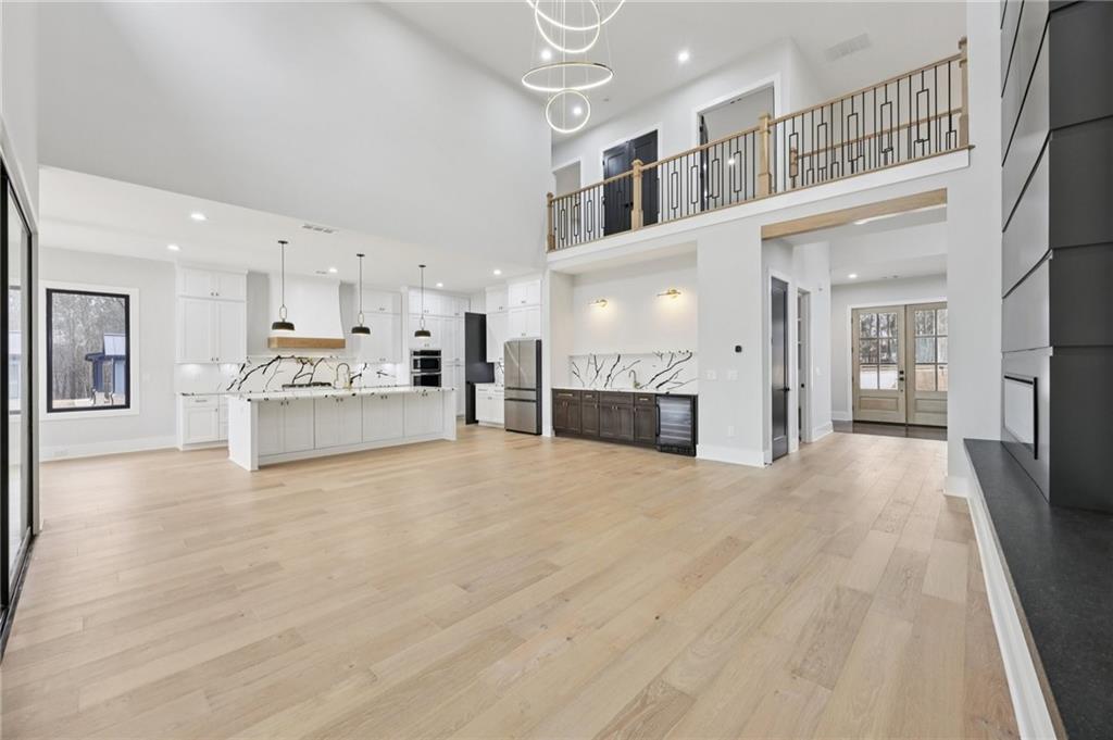 24 Rocking Wood Drive Auburn, GA 30011 - Photo 12 of 66 a view of a living room kitchen with a stove top oven