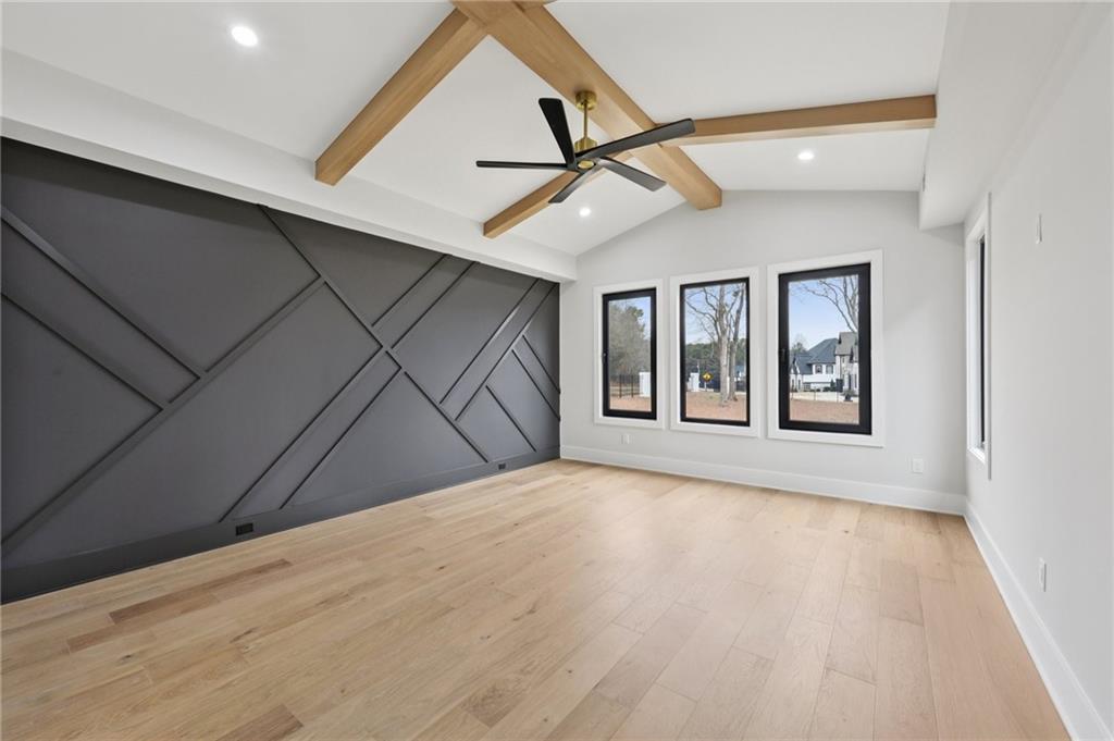 24 Rocking Wood Drive Auburn, GA 30011 - Photo 29 of 66 a view of an empty room with a window and wooden floor