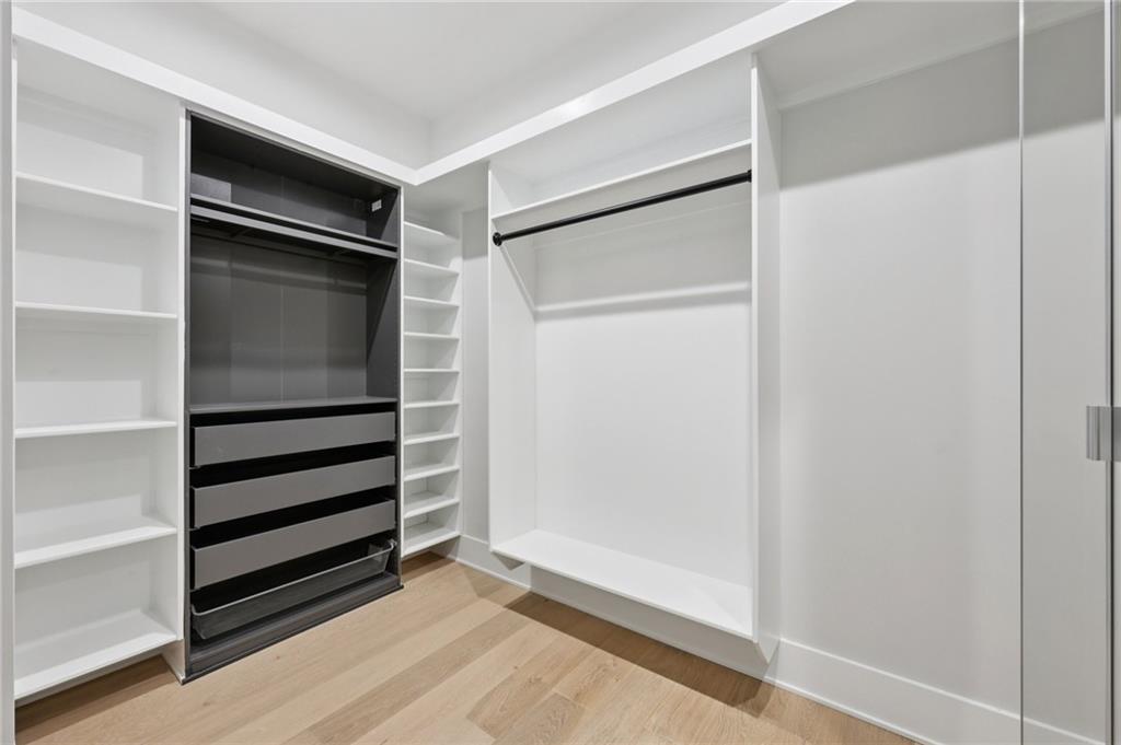 24 Rocking Wood Drive Auburn, GA 30011 - Photo 35 of 66 a view of walk in closet with empty racks