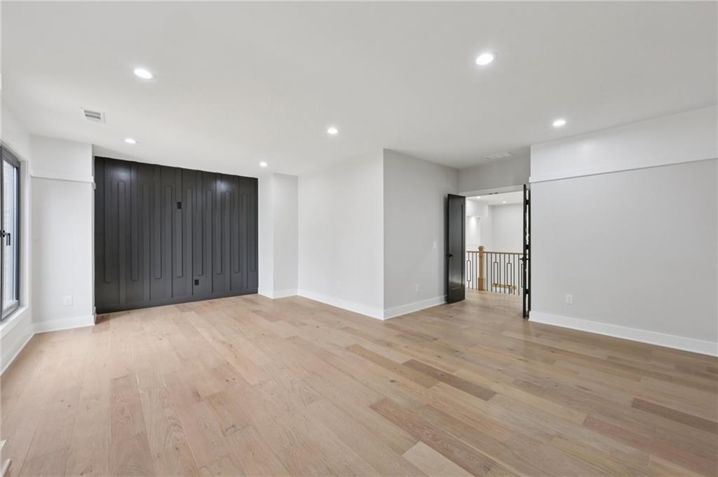 24 Rocking Wood Drive Auburn, GA 30011 - Photo 39 of 66 a view of an empty room with wooden floor