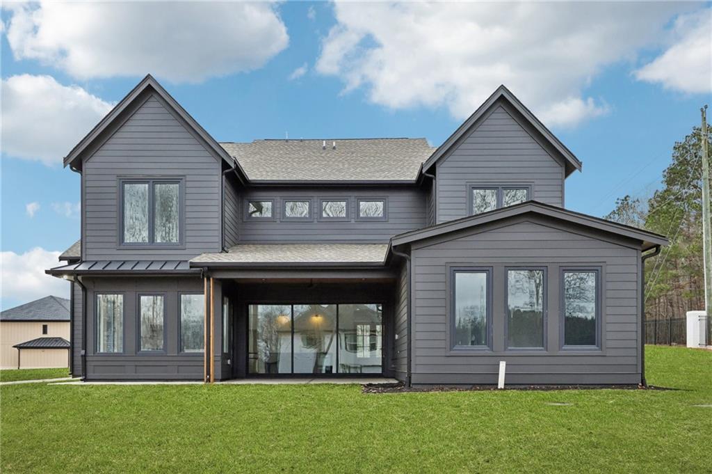 24 Rocking Wood Drive Auburn, GA 30011 - Photo 4 of 66 a front view of a house with a yard