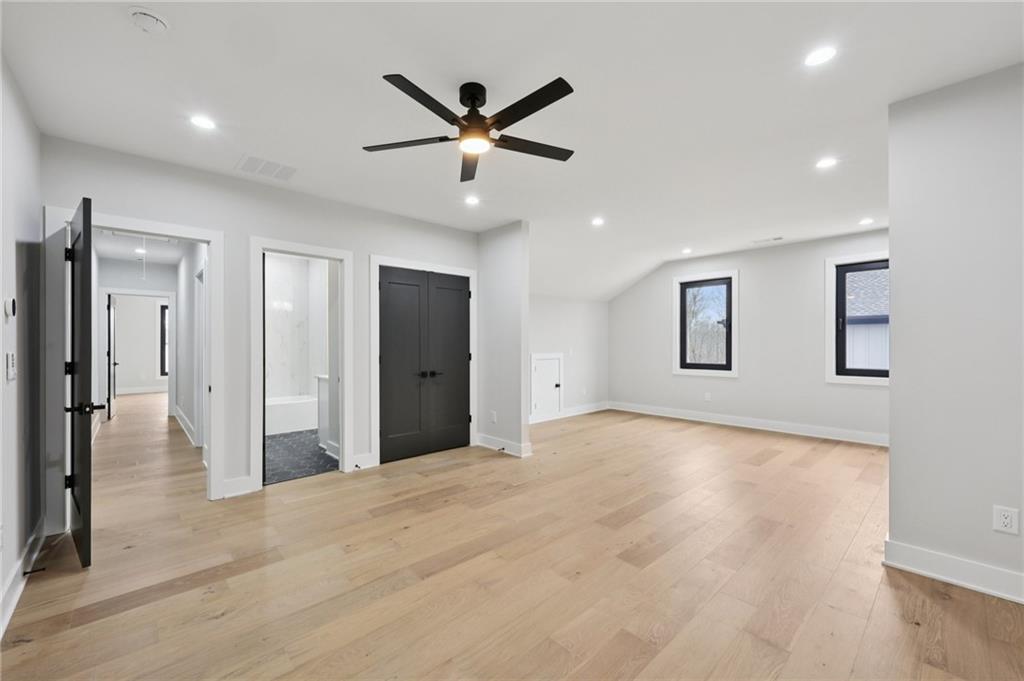 24 Rocking Wood Drive Auburn, GA 30011 - Photo 47 of 66 a view of a livingroom with a ceiling fan and window