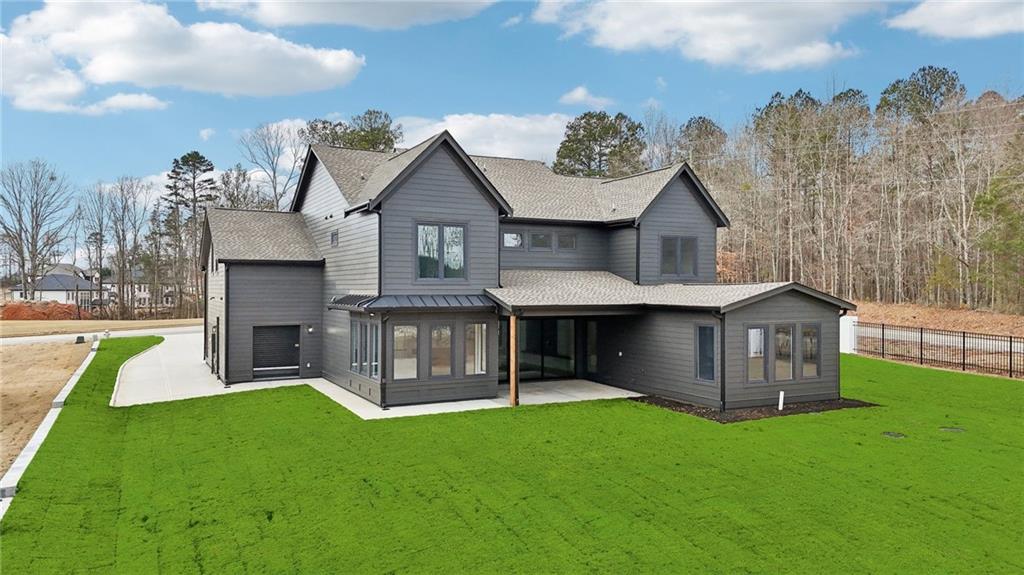 24 Rocking Wood Drive Auburn, GA 30011 - Photo 5 of 66 a view of a house with a backyard porch and sitting area