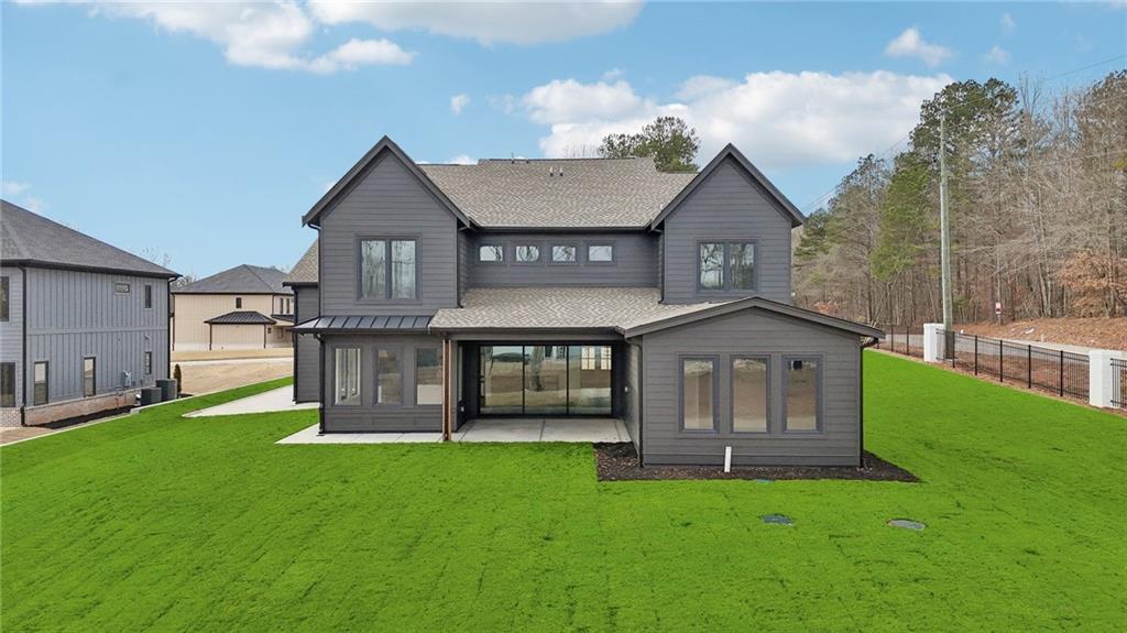 24 Rocking Wood Drive Auburn, GA 30011 - Photo 59 of 66 a view of a house with a yard and a garden