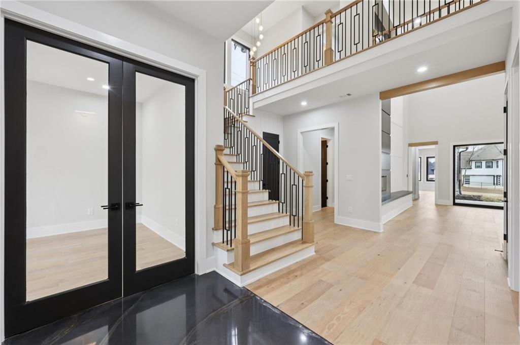 24 Rocking Wood Drive Auburn, GA 30011 - Photo 6 of 66 a view of entryway and hall with wooden floor