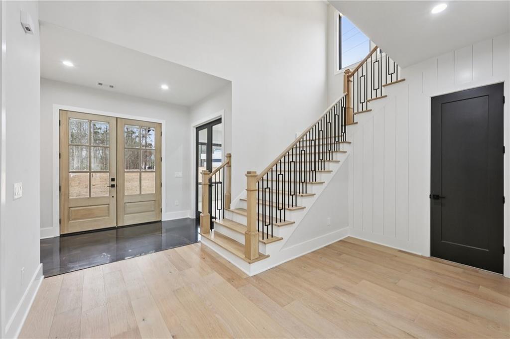 24 Rocking Wood Drive Auburn, GA 30011 - Photo 10 of 66 a view of entryway and hall with wooden floor