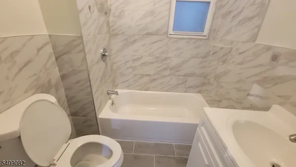 a bath tub sitting in a bathroom