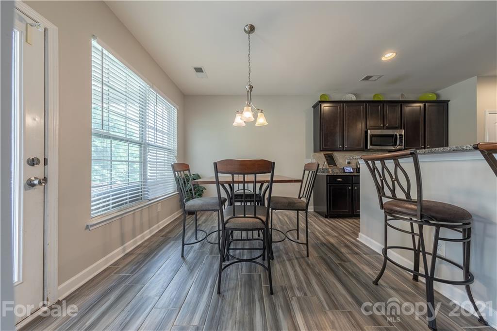 364 Lorraine Road Fort Mill, SC 29708 - Photo 16 of 39 a view of a dining room with furniture window and wooden floor