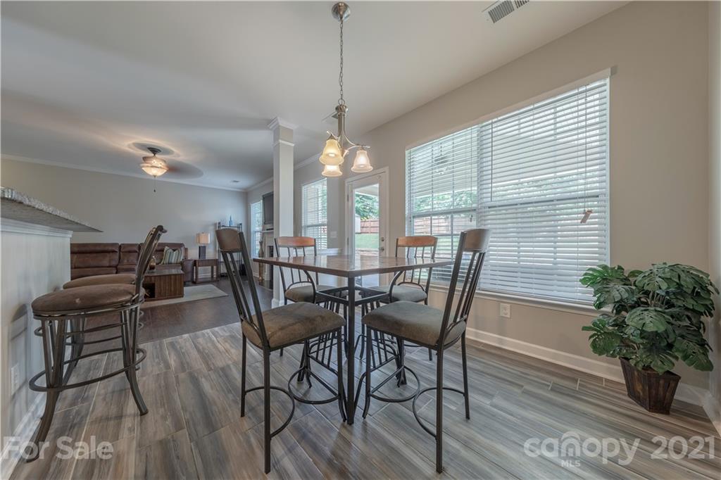 364 Lorraine Road Fort Mill, SC 29708 - Photo 18 of 39 a view of a dining room with furniture window and wooden floor