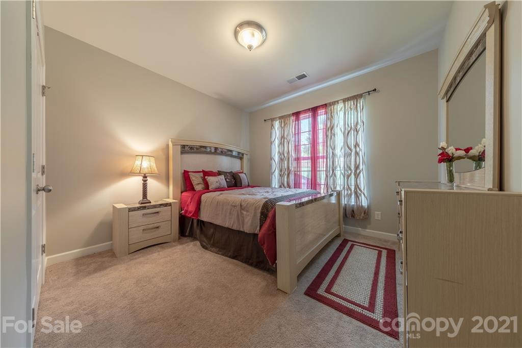364 Lorraine Road Fort Mill, SC 29708 - Photo 19 of 39 a bed room with a bed and a couch