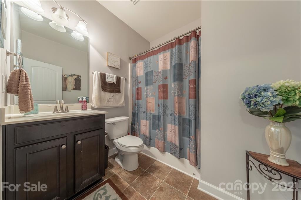 364 Lorraine Road Fort Mill, SC 29708 - Photo 20 of 39 a bathroom with a sink toilet a mirror and shower