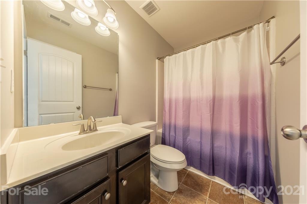 364 Lorraine Road Fort Mill, SC 29708 - Photo 29 of 39 a bathroom with a sink a toilet and shower curtain