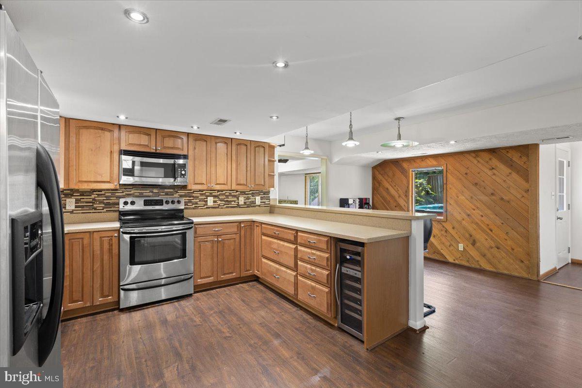 425 Mountain Road Crownsville, MD 21032 - Photo 14 of 69 a kitchen with stainless steel appliances granite countertop a stove a sink and a refrigerator