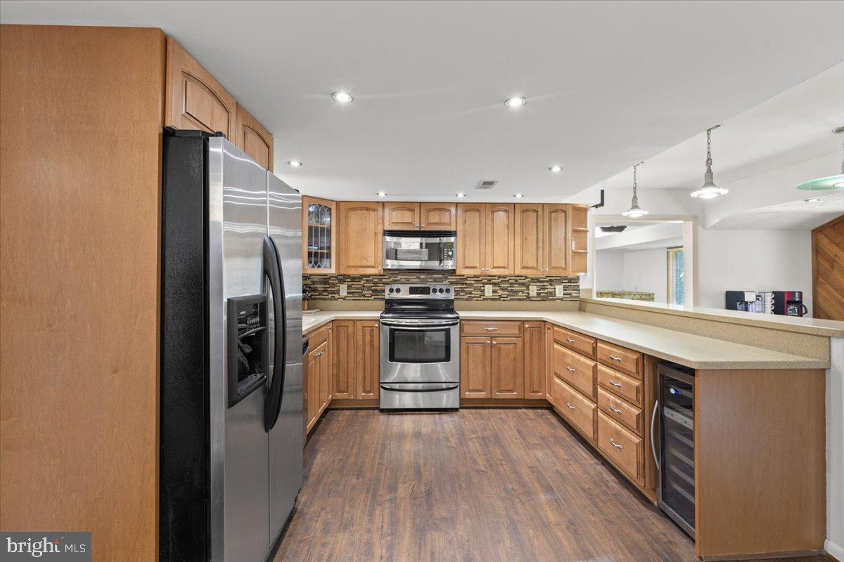 425 Mountain Road Crownsville, MD 21032 - Photo 15 of 69 a kitchen with stainless steel appliances a refrigerator sink and cabinets