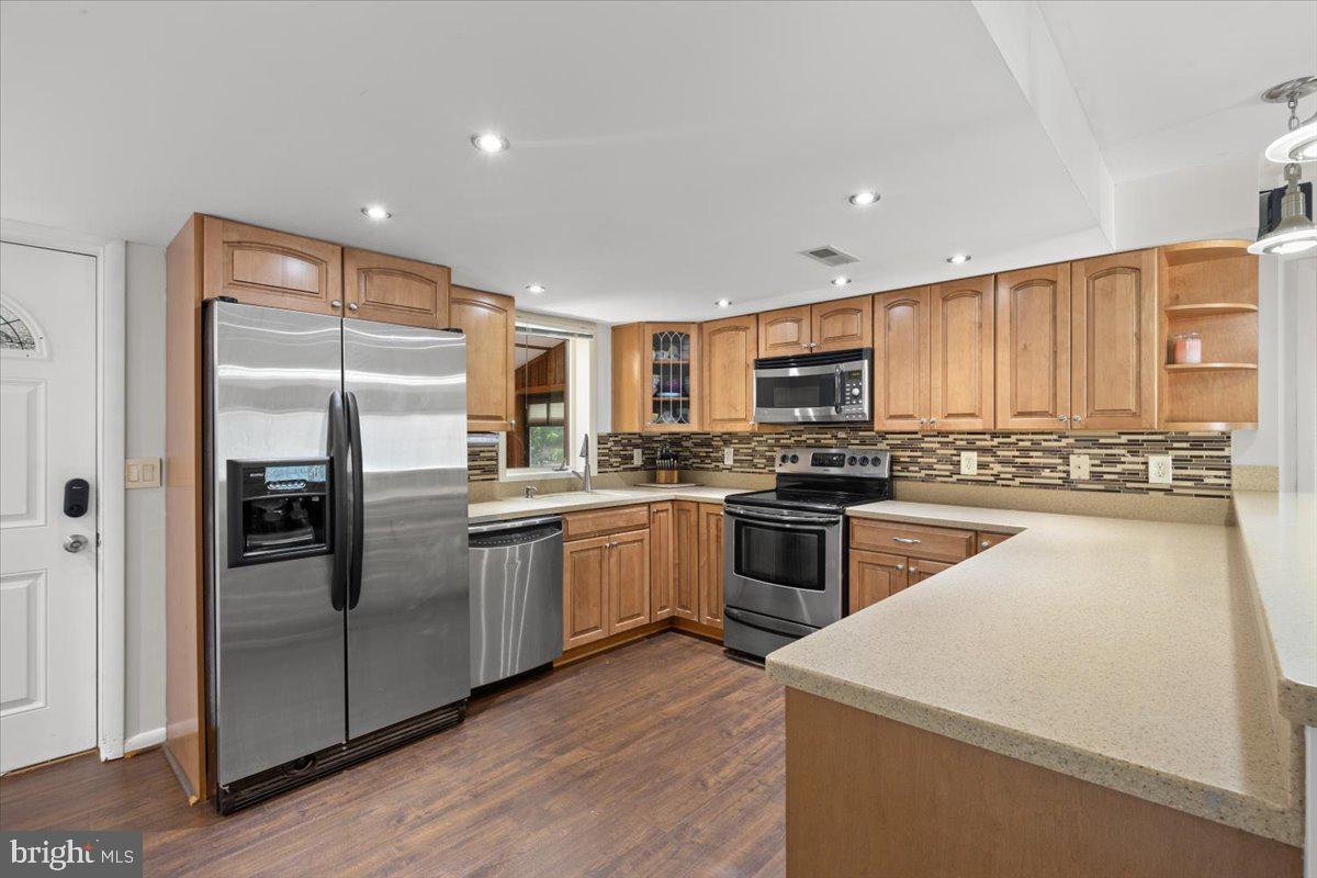 425 Mountain Road Crownsville, MD 21032 - Photo 16 of 69 a kitchen with granite countertop stainless steel appliances and wooden cabinets
