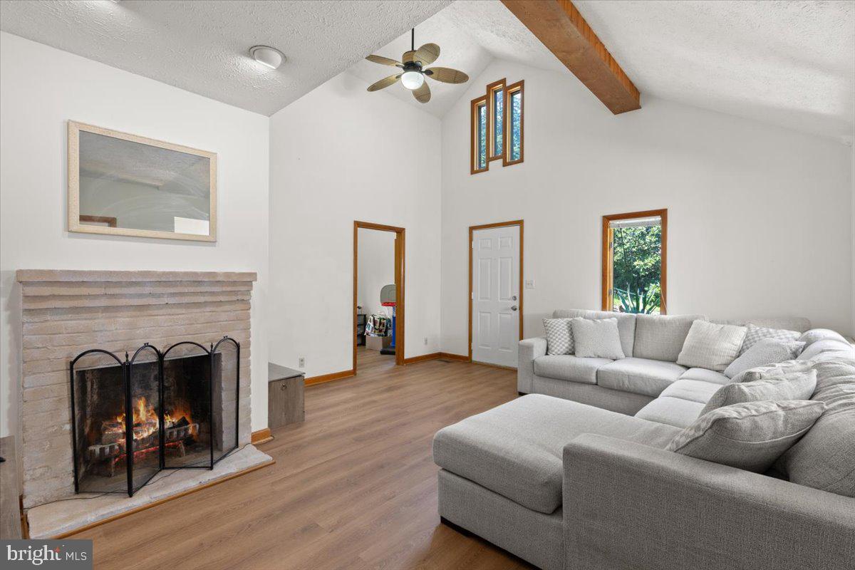 425 Mountain Road Crownsville, MD 21032 - Photo 28 of 69 a living room with furniture and a fireplace