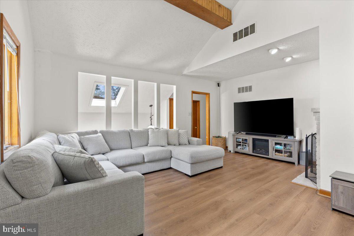 425 Mountain Road Crownsville, MD 21032 - Photo 29 of 69 a living room with furniture and a flat screen tv