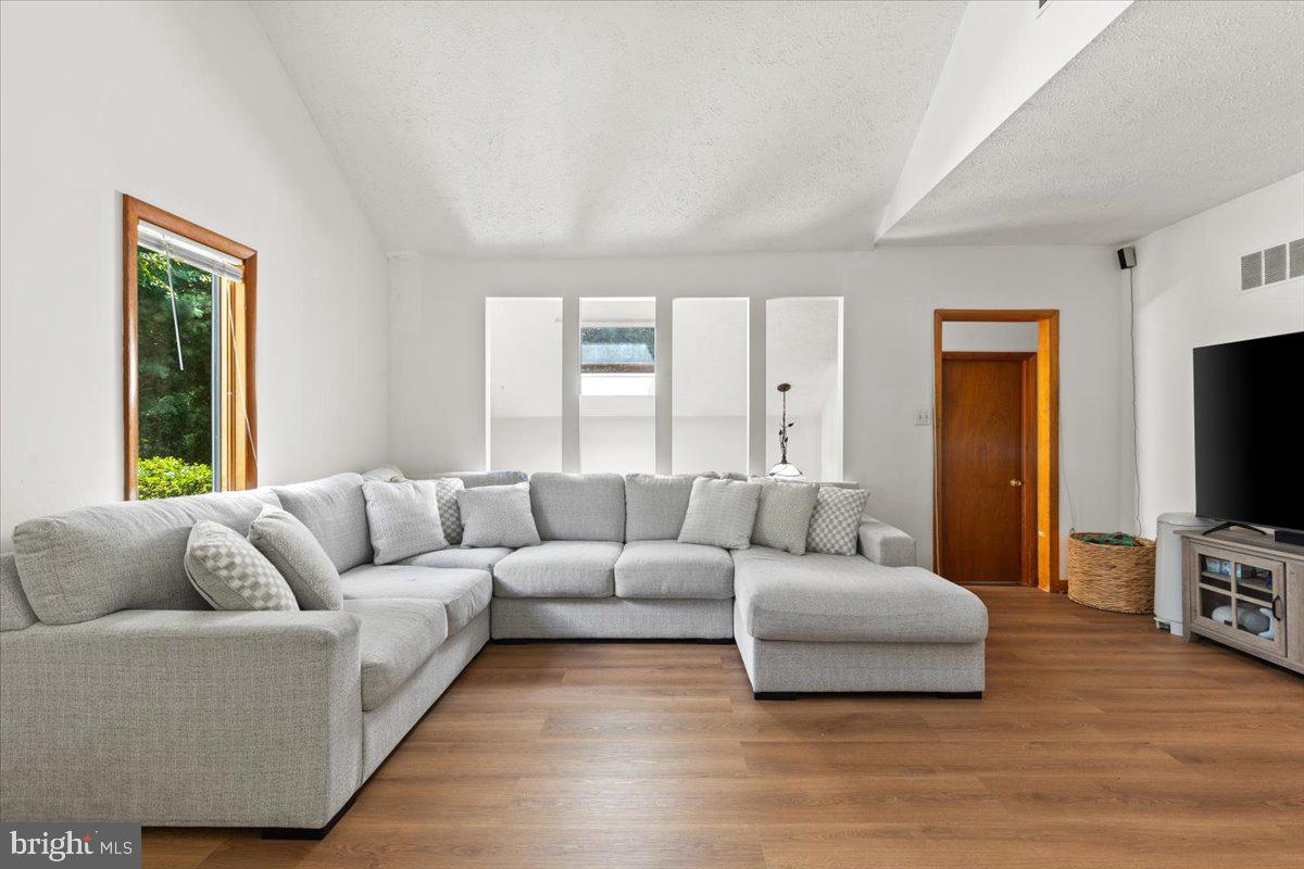 425 Mountain Road Crownsville, MD 21032 - Photo 30 of 69 a living room with furniture and a flat screen tv