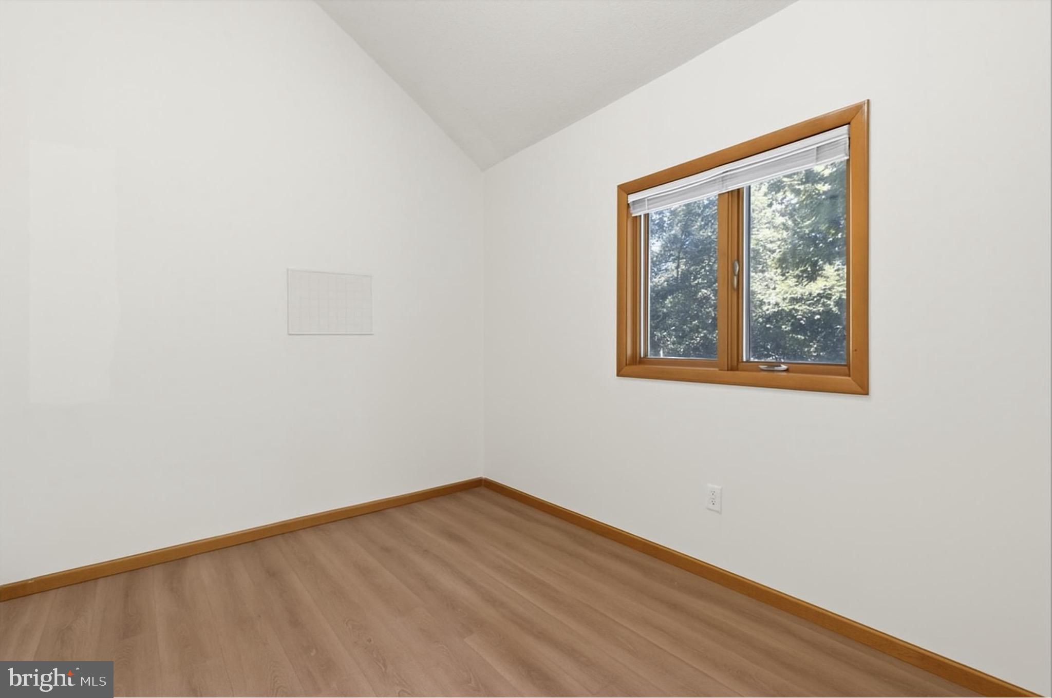 425 Mountain Road Crownsville, MD 21032 - Photo 33 of 69 a view of an empty room with wooden floor and a window