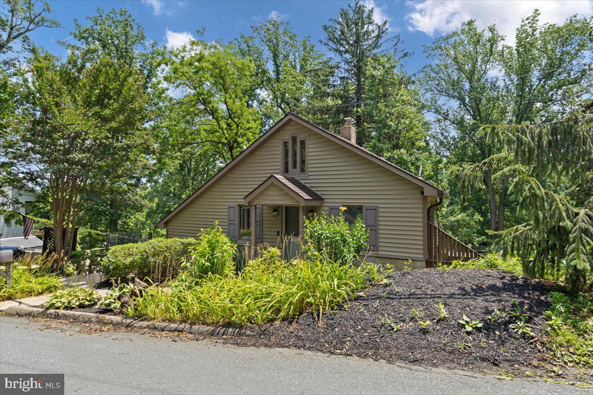425 Mountain Road Crownsville, MD 21032 - Photo 5 of 69 a house is sitting in middle of the garden