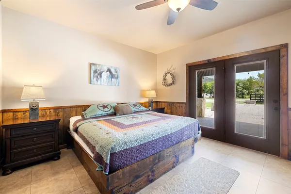 a bedroom with bed and window