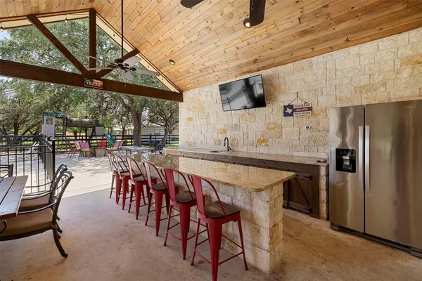 a view of a park with iron fence