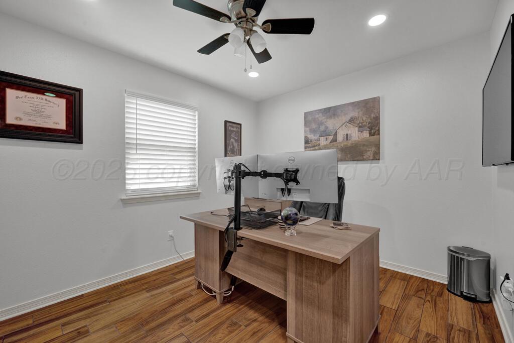 2405 Southwest 49th Avenue Amarillo, TX 79110 - Photo 12 of 25 a view of a workspace with furniture and a window
