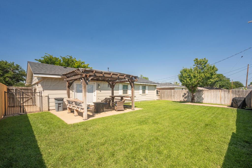 2405 Southwest 49th Avenue Amarillo, TX 79110 - Photo 23 of 25 a view of a house with a yard patio and sitting area