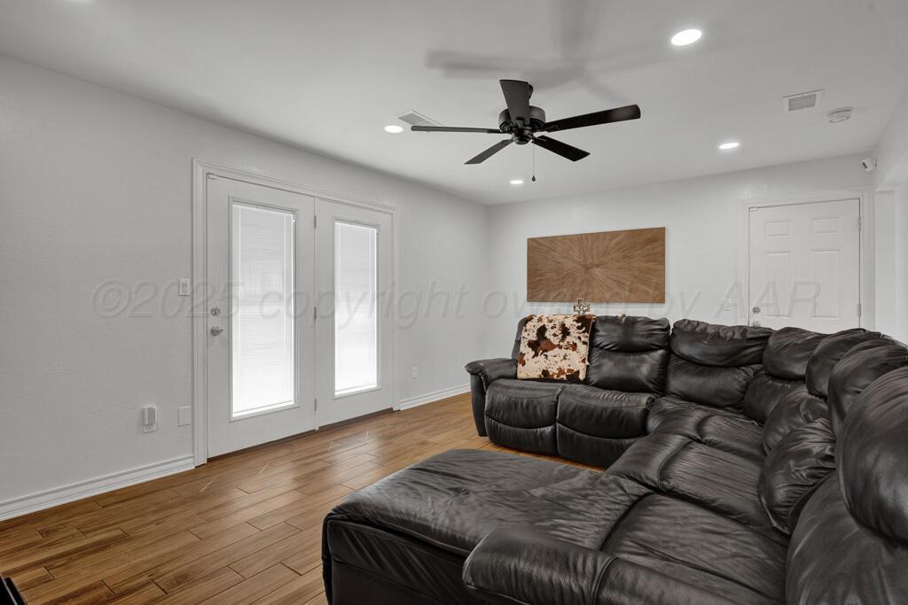 2405 Southwest 49th Avenue Amarillo, TX 79110 - Photo 6 of 25 a living room with a couch and a window
